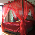 东南亚风情个性婚房喜庆红色卧室装修效果图